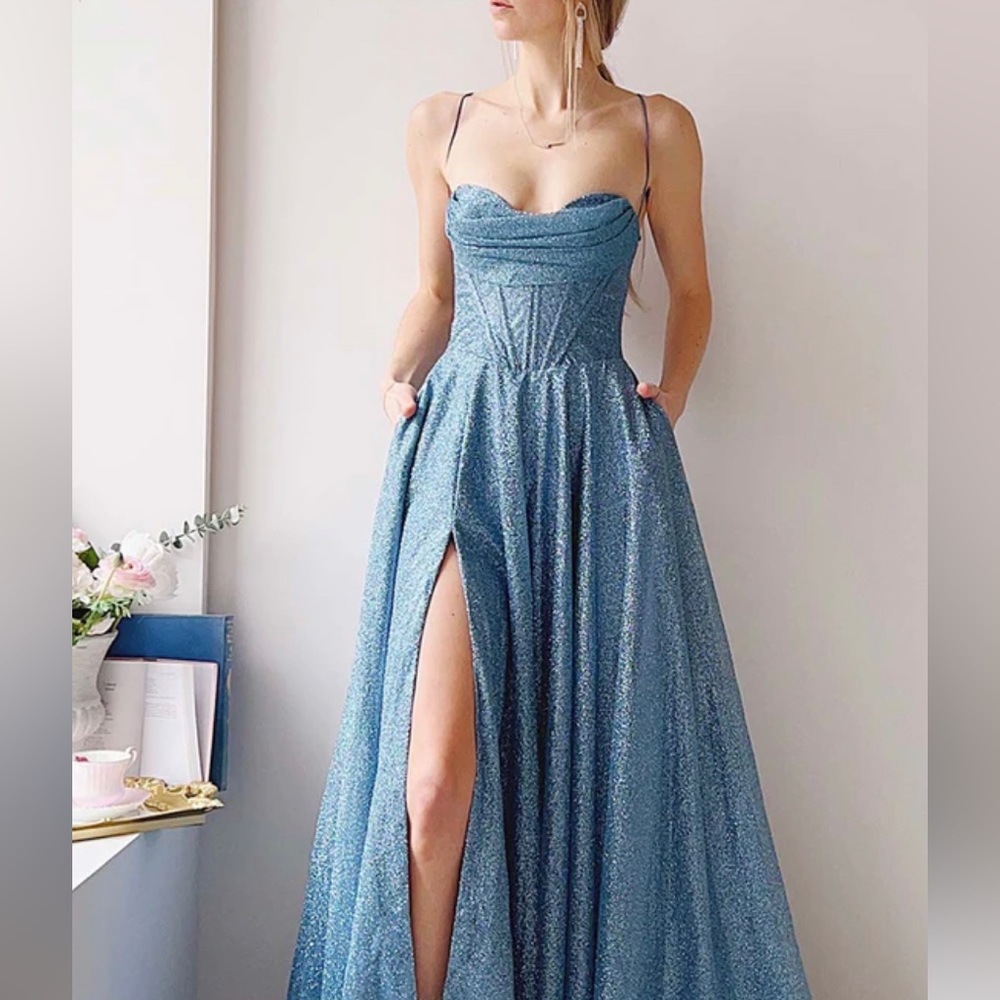 Beautiful blue prom dress for sale! Worn only once and in excellent condition.